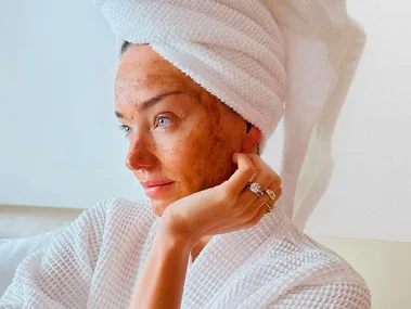 A woman wearing a towel in her hair with a DIY Skin Treatment on