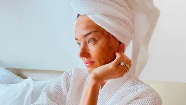 A woman wearing a towel in her hair with a DIY Skin Treatment on