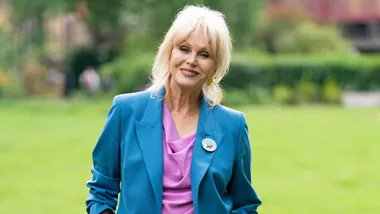 Joanna Lumley smiling in a blue suit