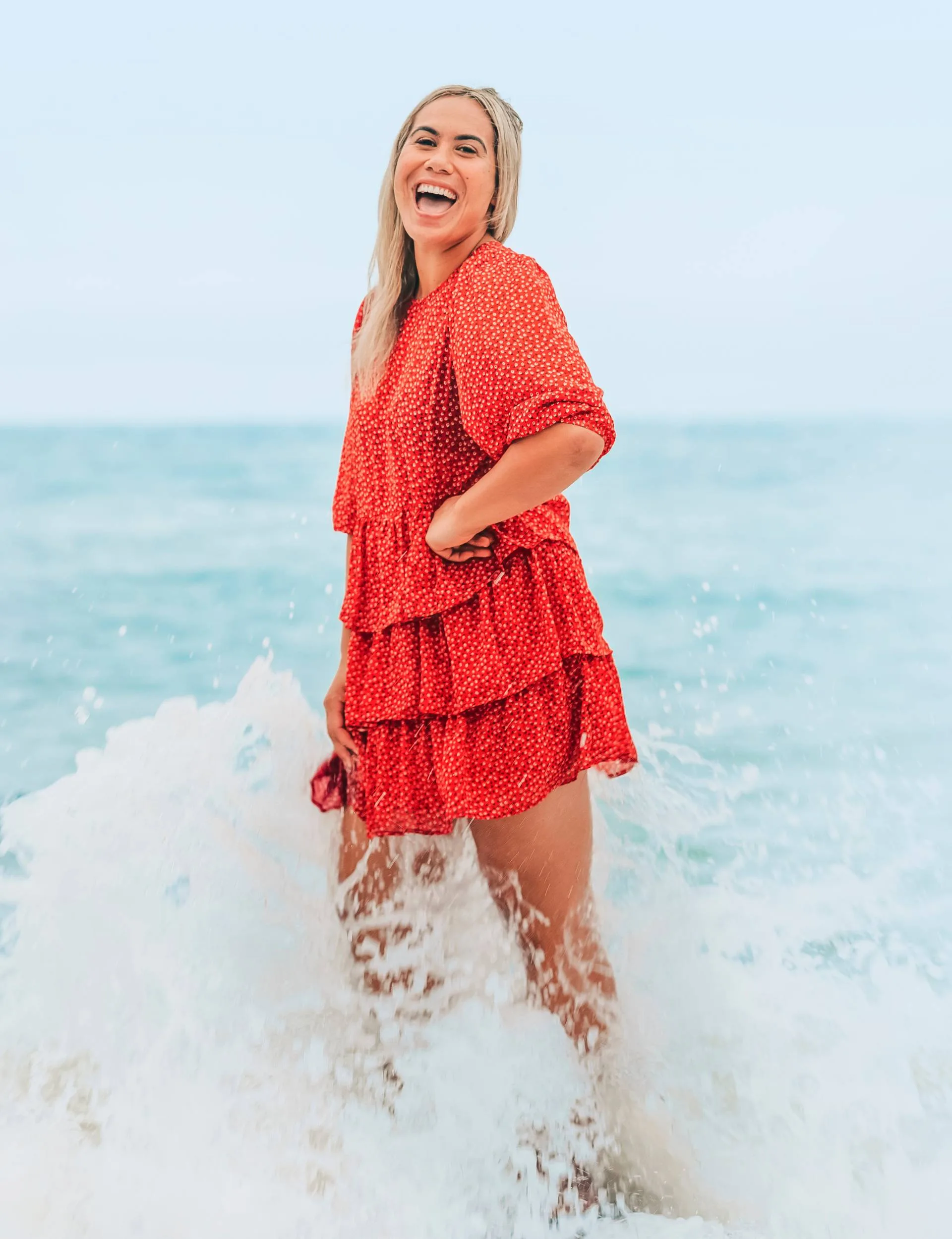 Huriana standing in the whitewash at the beach