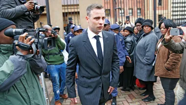 Oscar Pistorius walking out of a courthouse