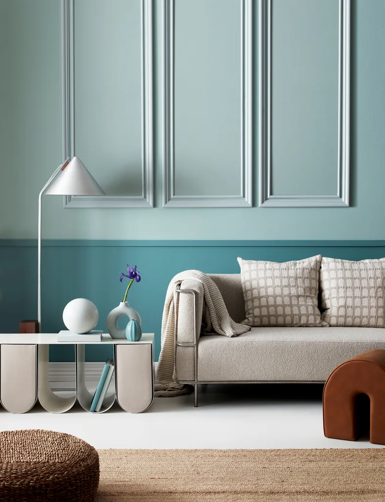 Delicate pastels are anchored in this living area by a deeper aqua