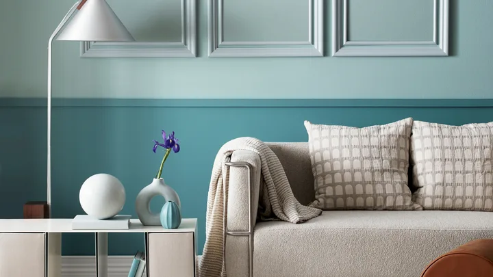 Pastel colours are anchored in this living area by a deeper aqua
