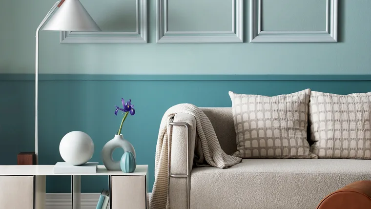 Pastel colours are anchored in this living area by a deeper aqua