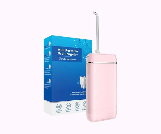 Mini portable water flosser on lilac background