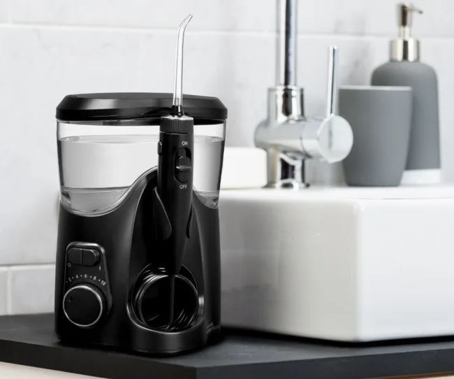 Black Waterpik Ultra on bathroom counter