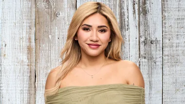 MAFS star Awhina in front of a wooden wall