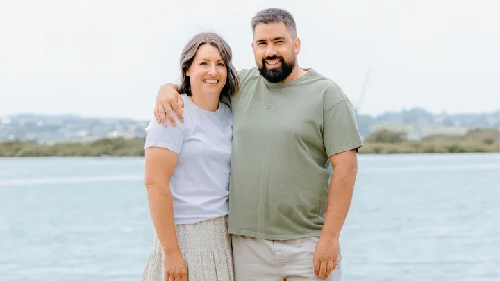 Manaia Stewart with his partner in front of a lake