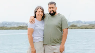 Manaia Stewart with his partner in front of a lake