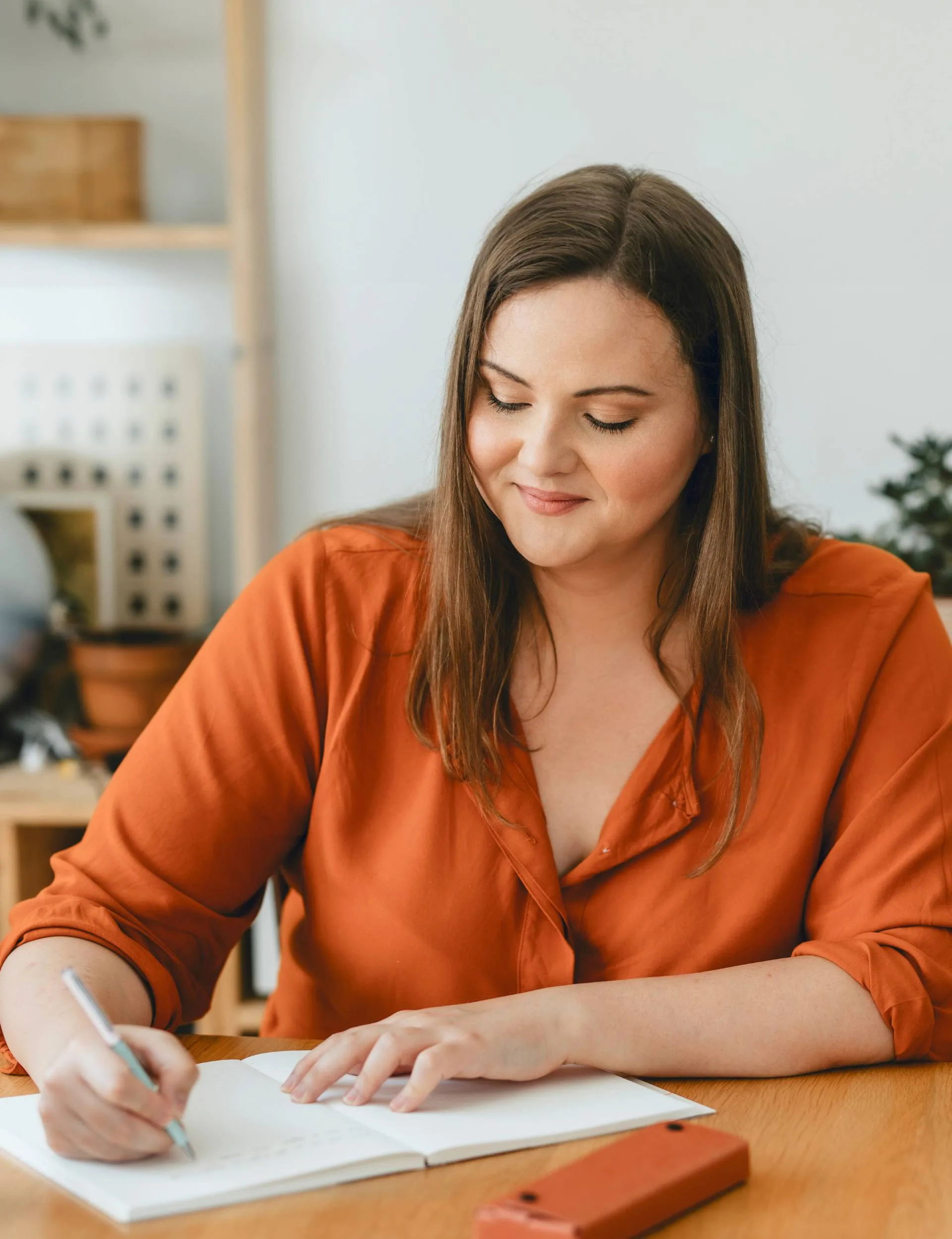 A woman journaling about how to love your body