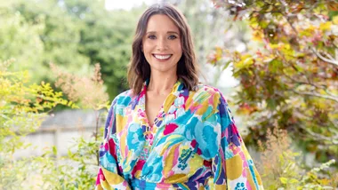 Anna Jullienne smiling in a colourful shirt