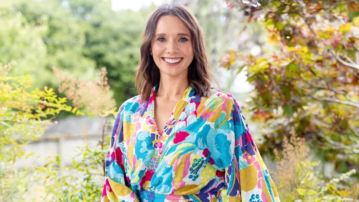 Anna Jullienne smiling in a colourful shirt