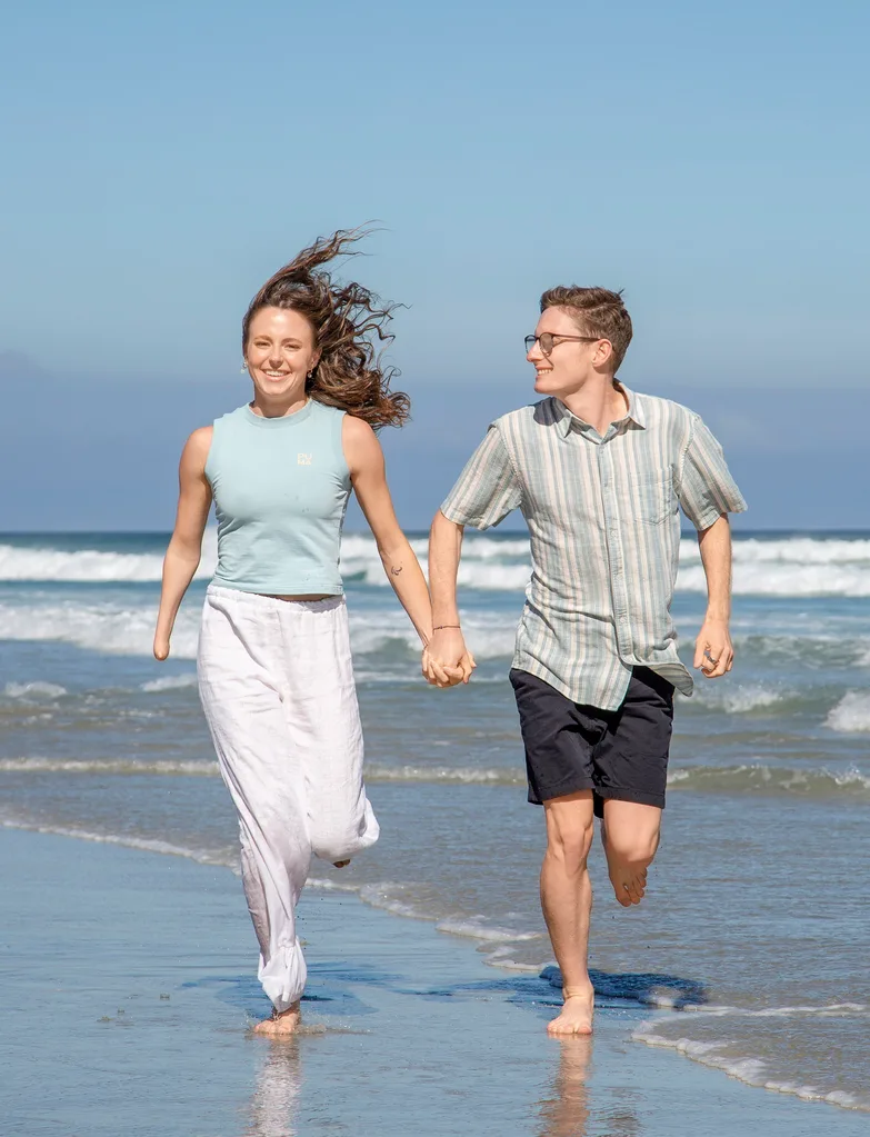 anna grimaldi jaryd clifford holding hands running down beach