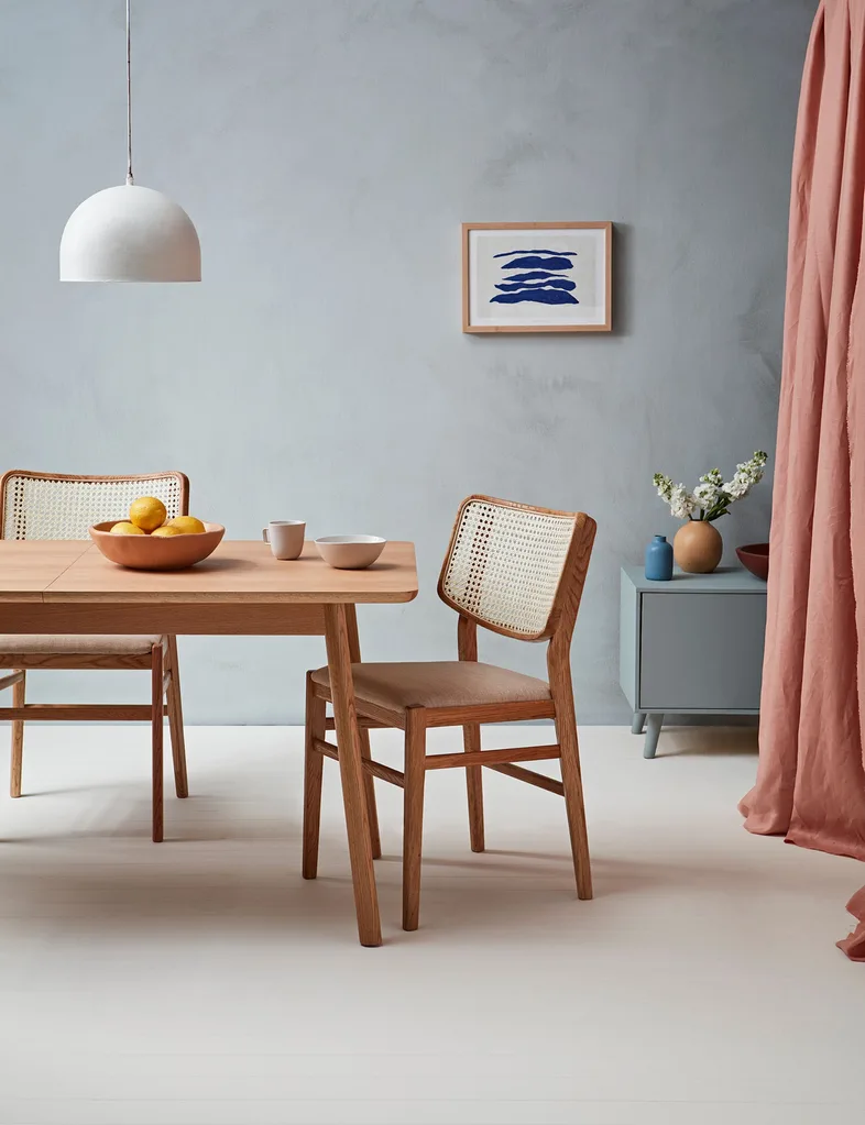 Retro dining room features fun wooden furnishings that stand out against the cool walls painted in Resene Duck Egg Blue