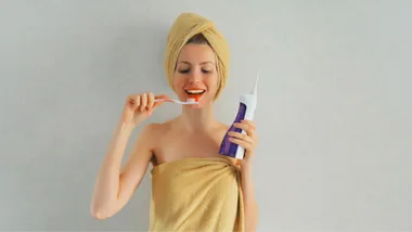 Woman using a water flosser