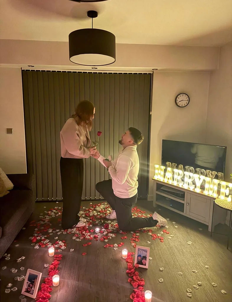 Man proposing to woman in living room