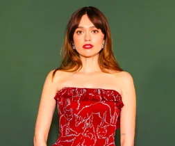 White Lotus star Aimee Lou Wood wearing strapless red dress with silver sequin detail