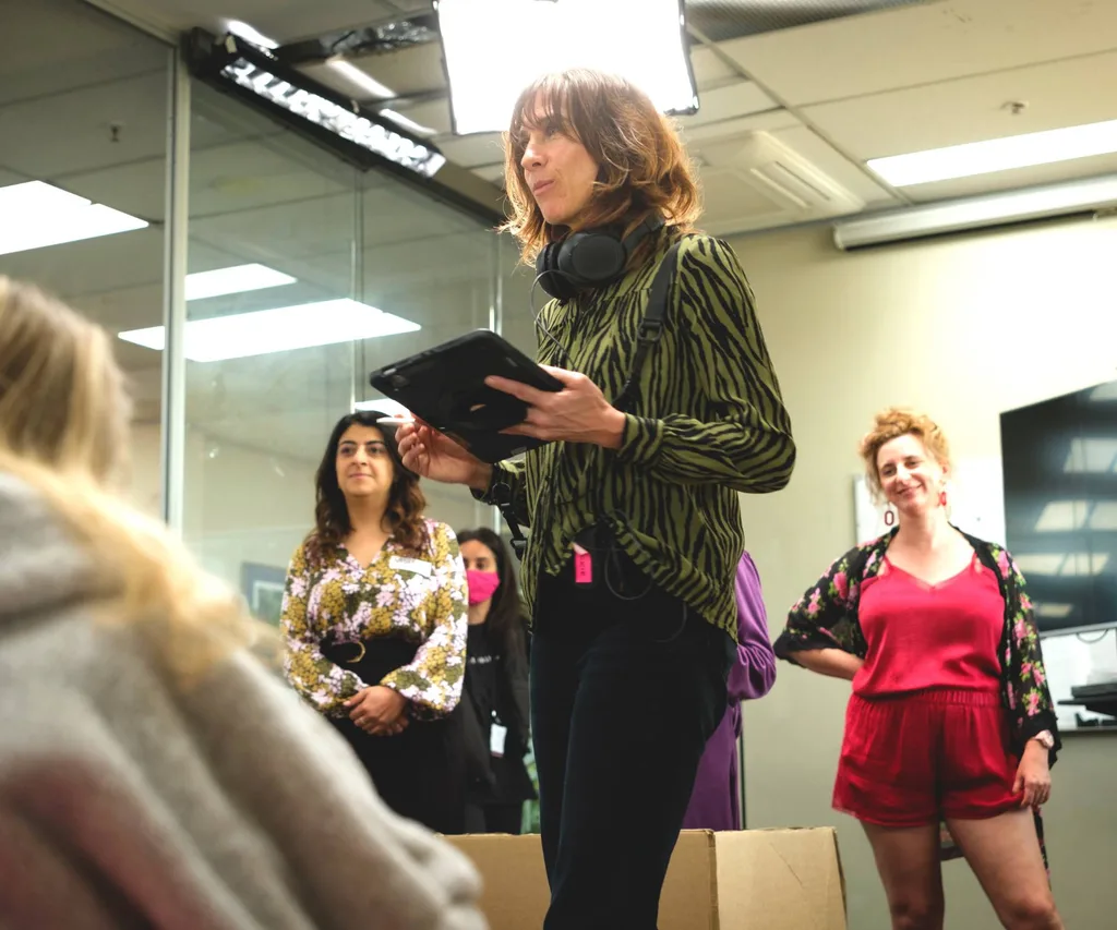 Woman directing actors on a film set