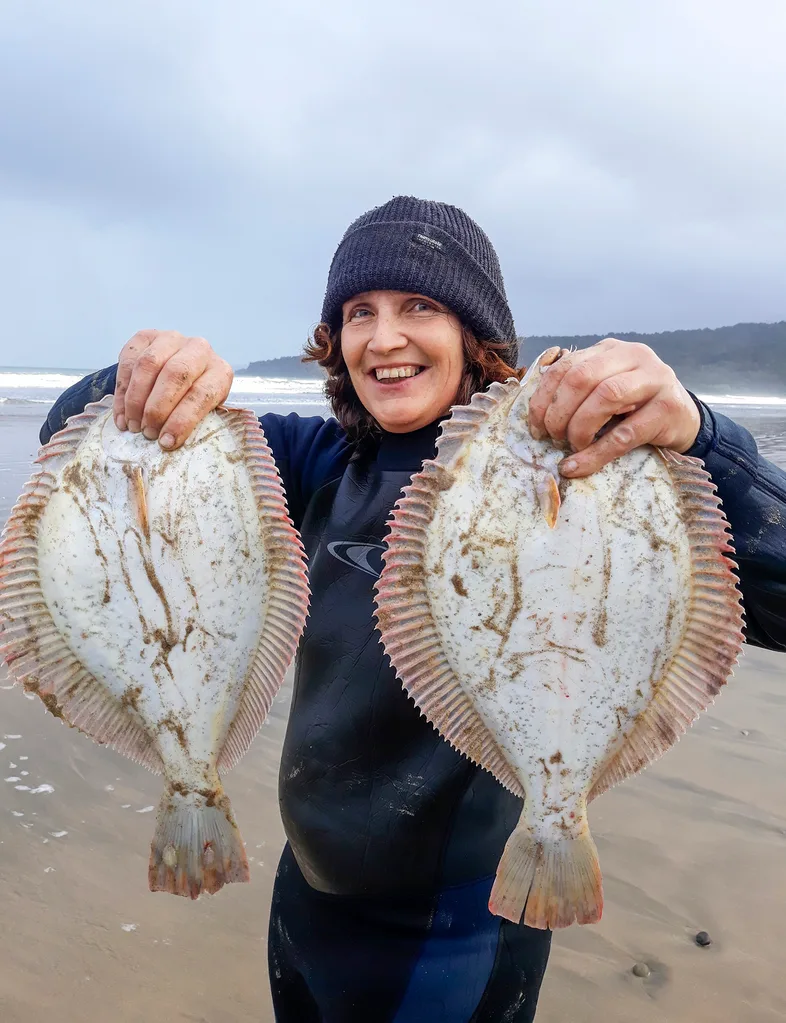 terressa kollatt holding freshly caught fish in each hand