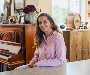 terressa kollatt sitting at table in her home