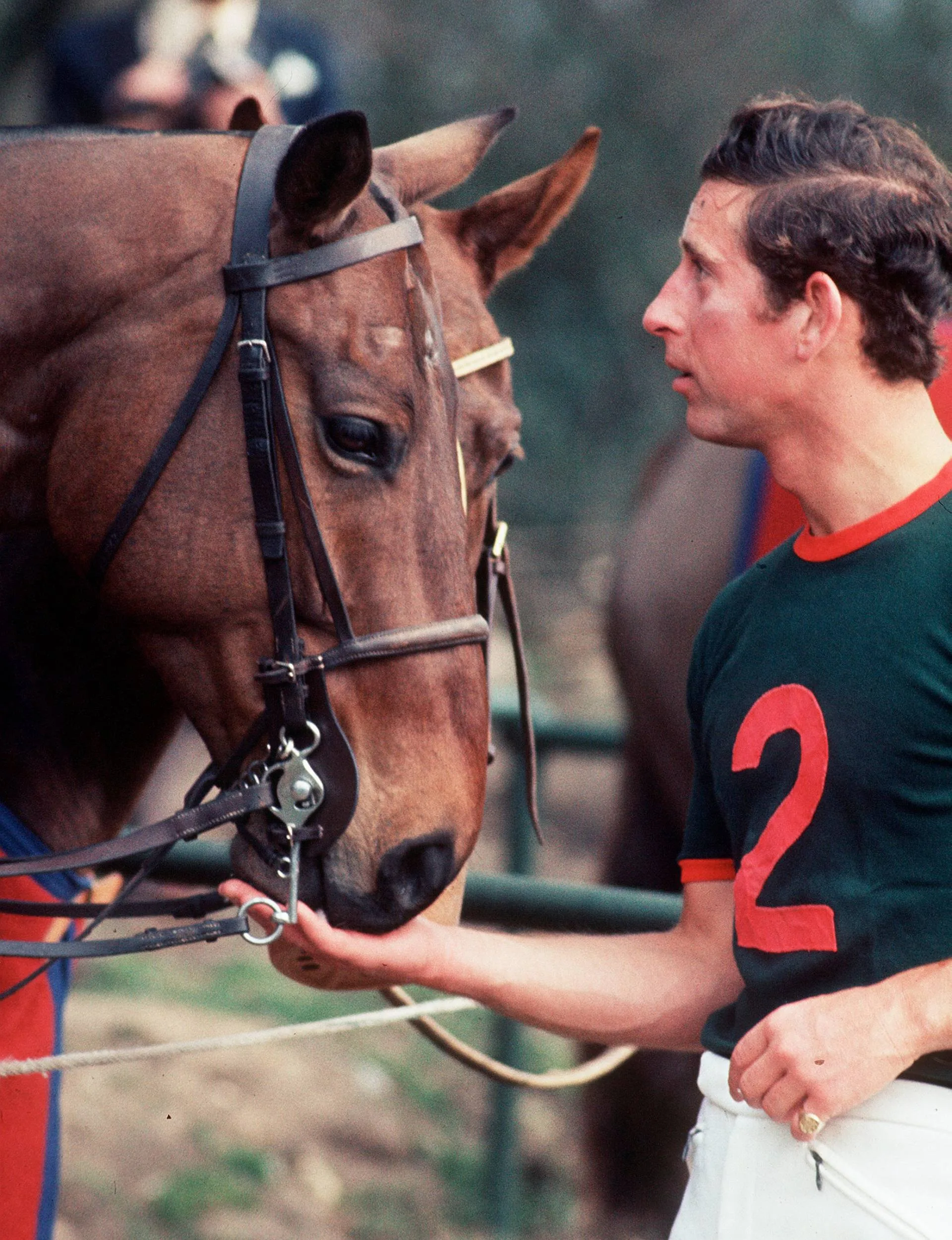 Charles with a horse in his Polo uniform