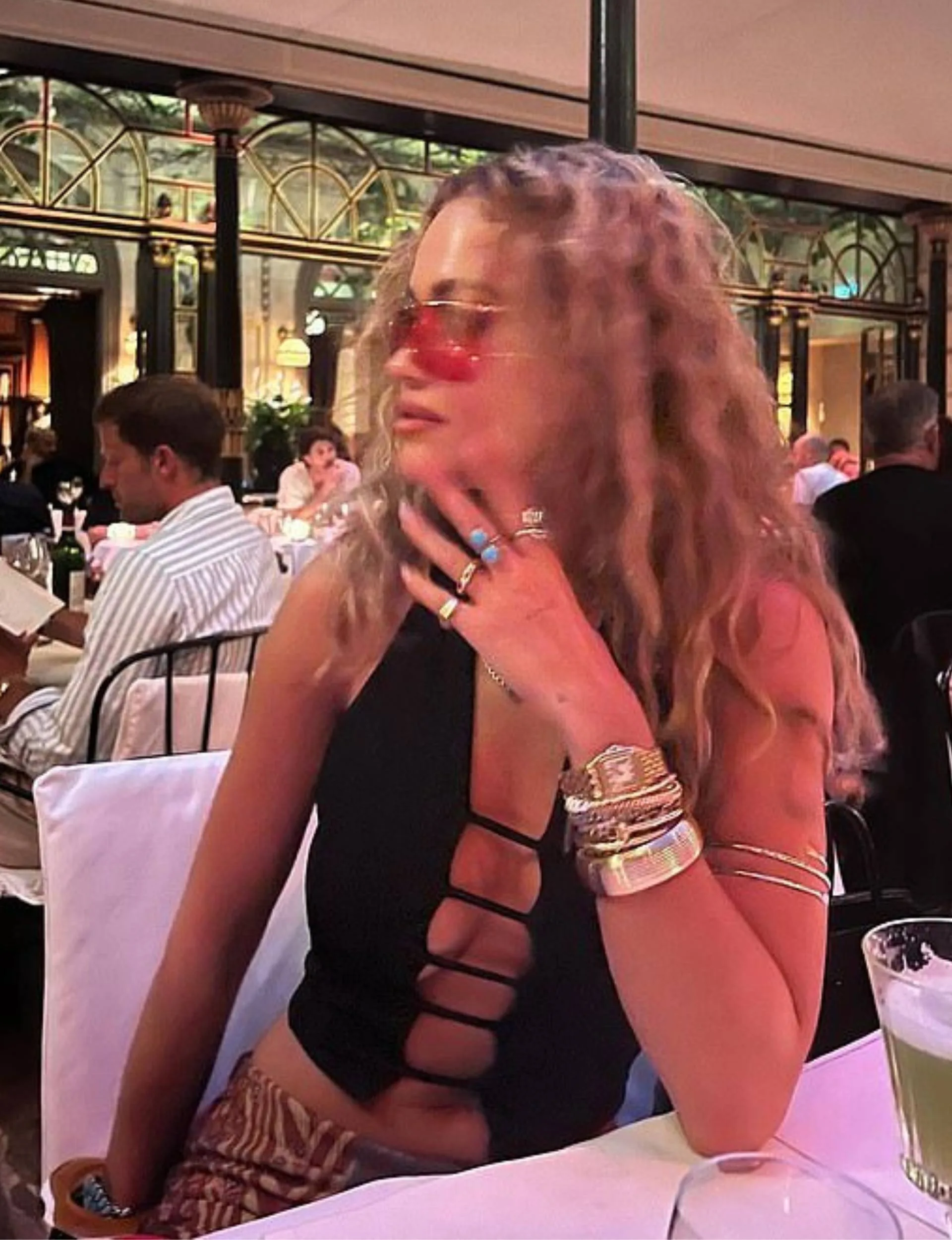 Rita Ora showing off a gold wedding band in a social media post