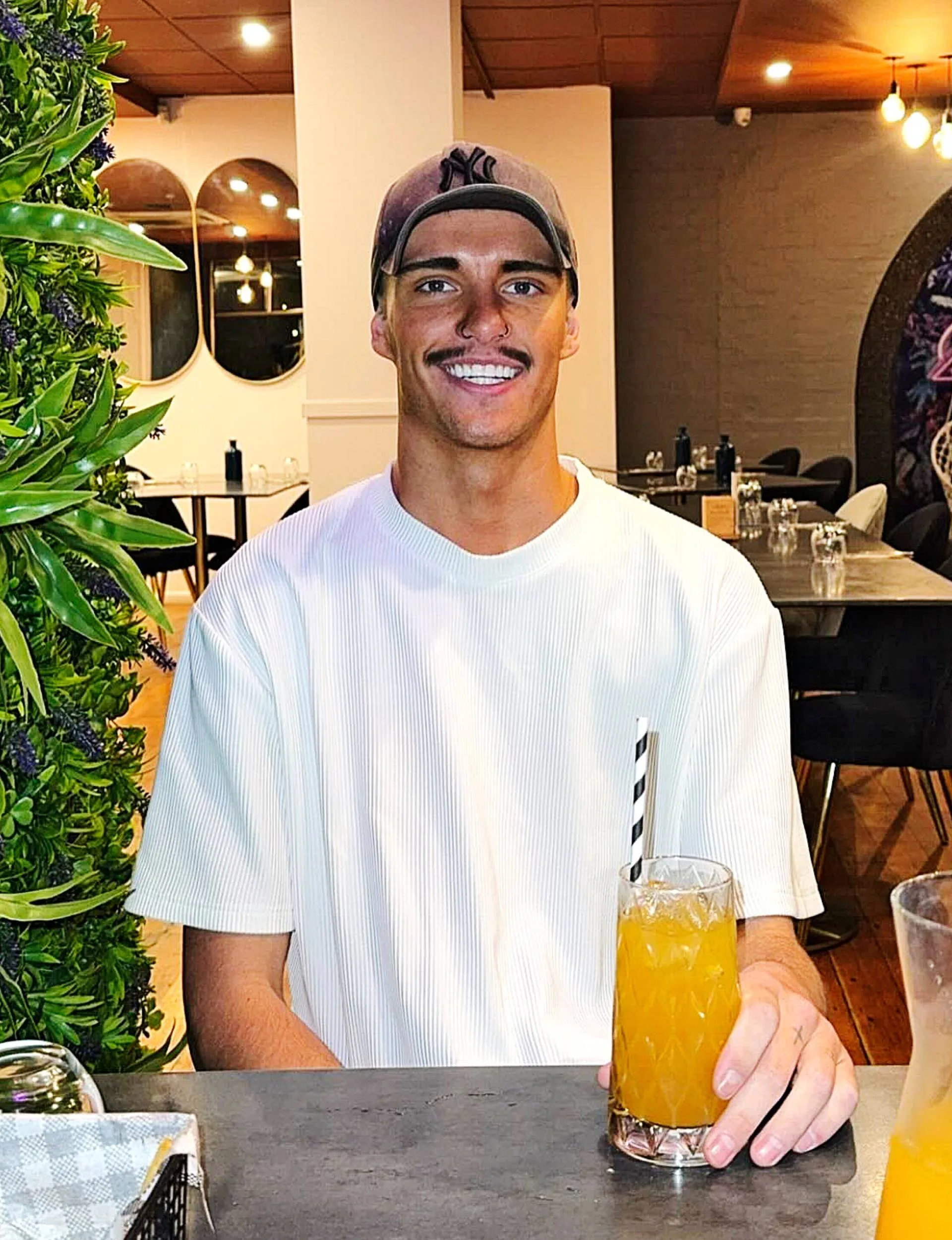 Influencer Tyson sitting at a bar