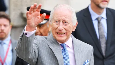 King Charles waving to the public