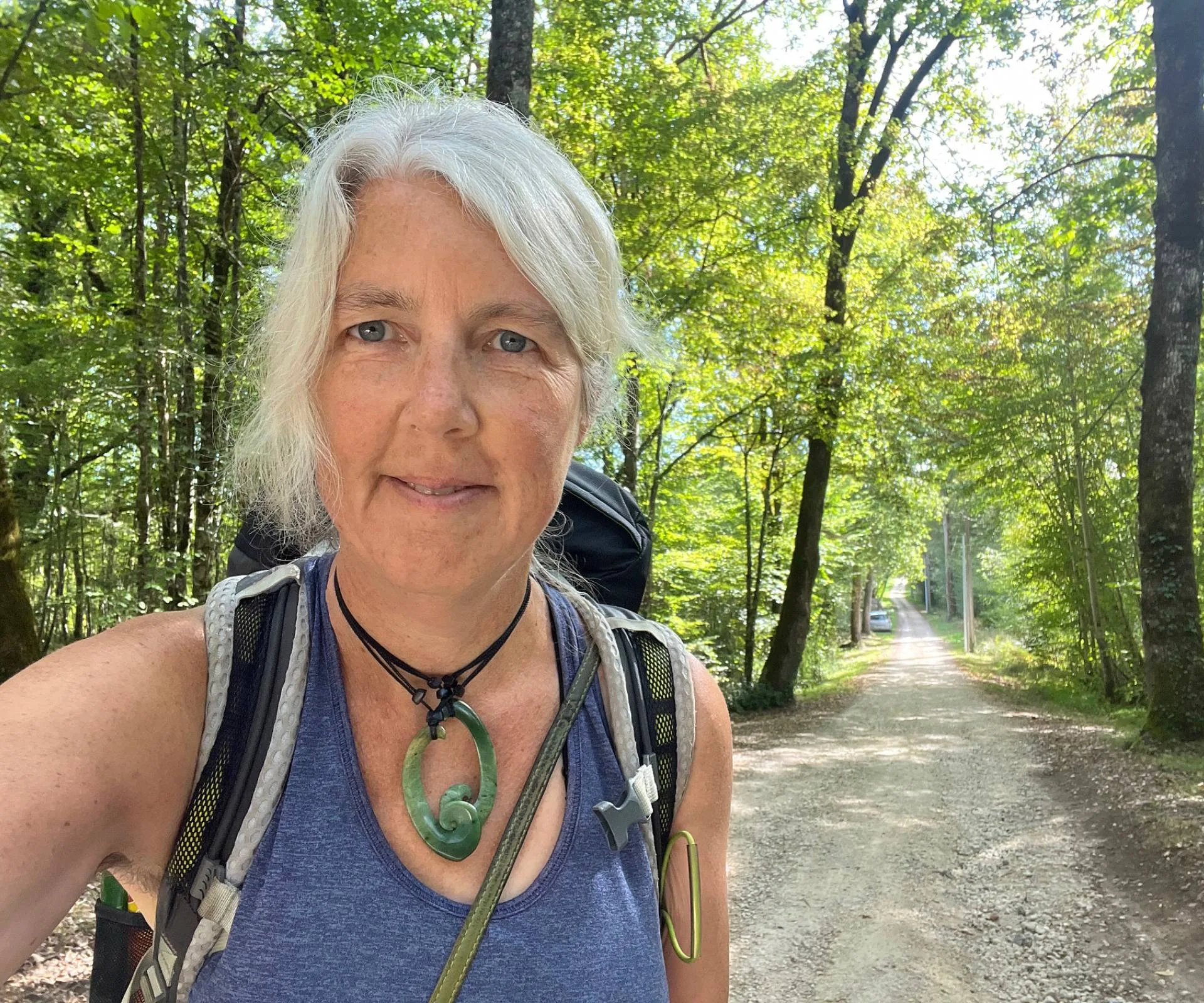 Jennifer Andrewes taking a selfie alone on a rural French road