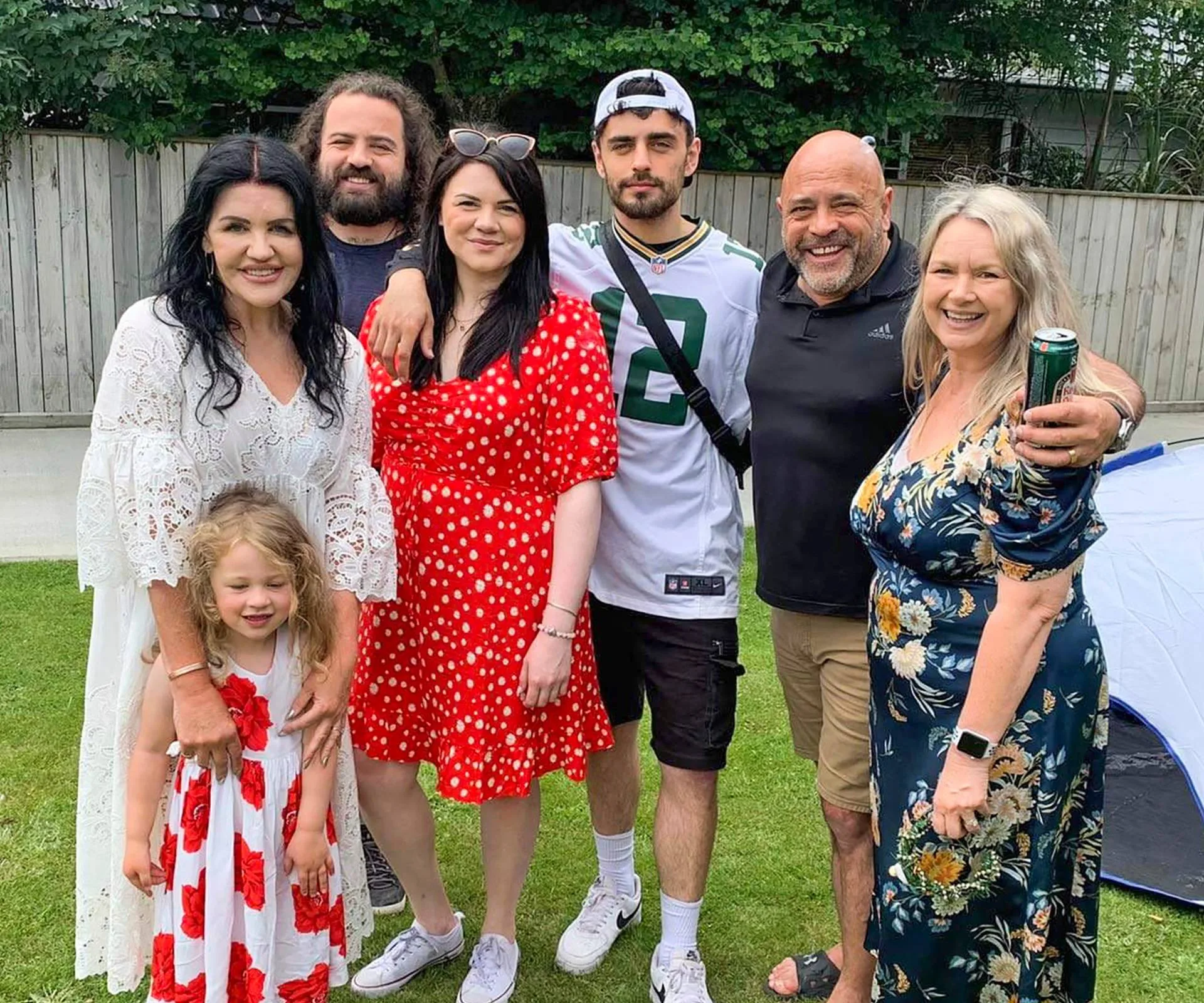 Polly Gillespie and Grant Kereama with their blended family on the lawn