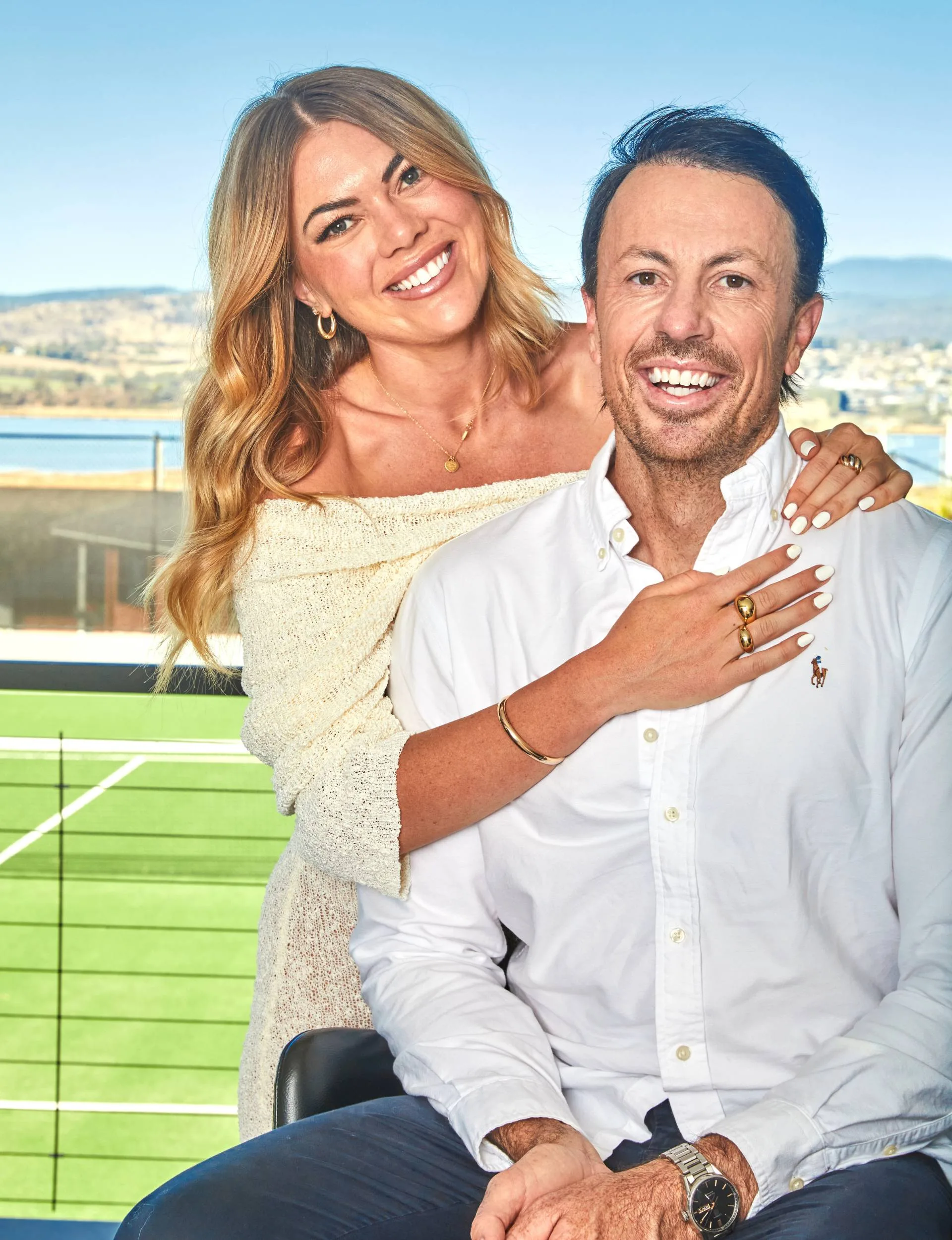 Jacqui and Clint on a balcony at his Tasmania home