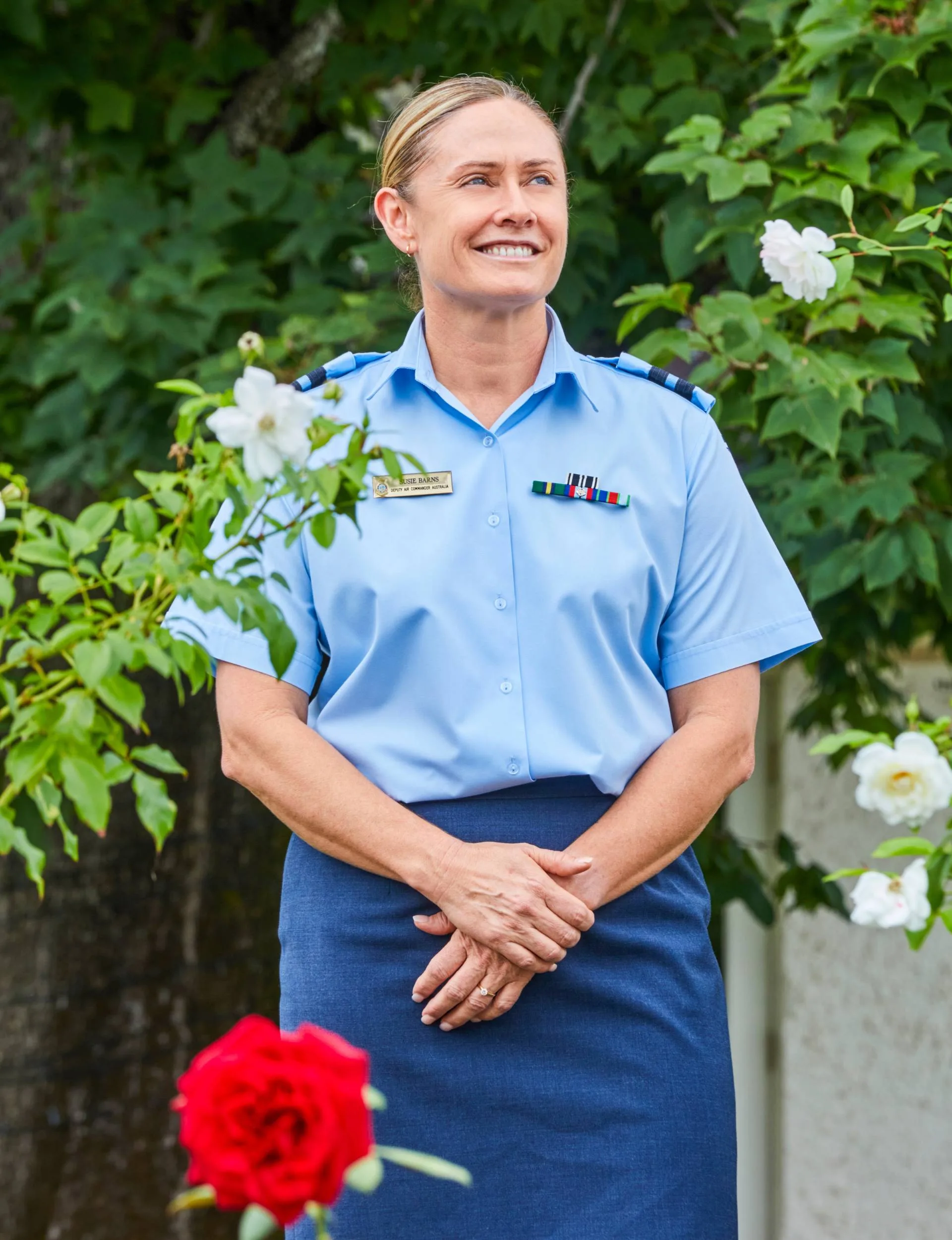 Susie Barns in a garden in her Air Force uniform