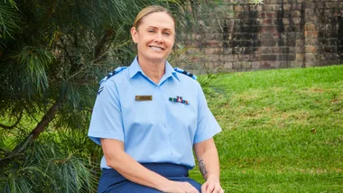 Susie Barns sitting in a garden in her Air Force uniform