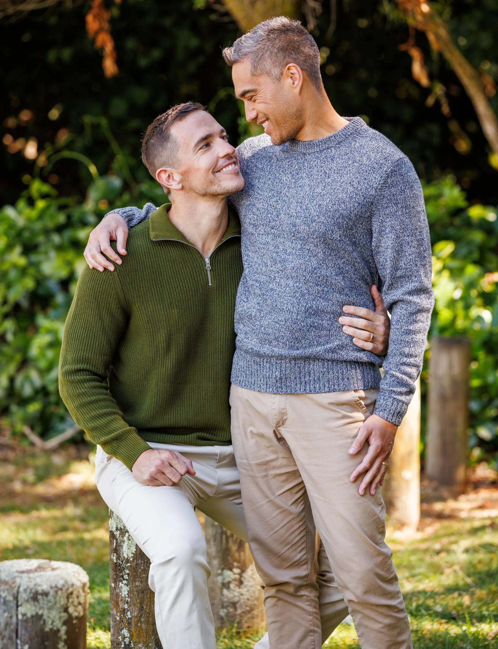 Harry McNaughton with his arm around his husband Koro's waist