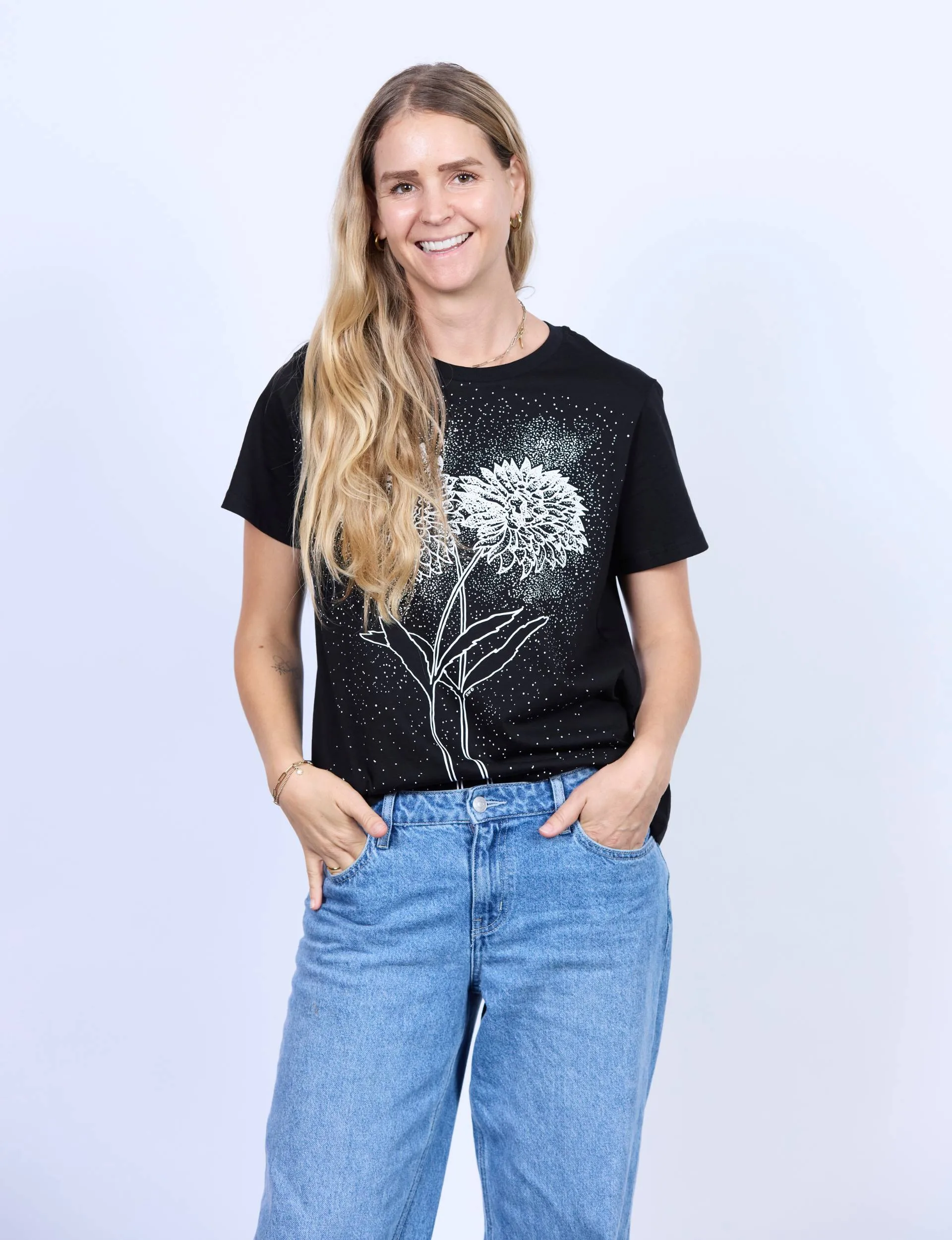 Anna Willcox wearing a dandelion tee designed by Karen Walker for Tees for a Cure.
