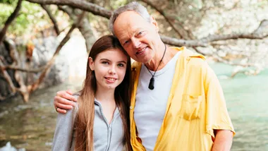Bruce Hopkins with his granddaughter Gracie on a beach