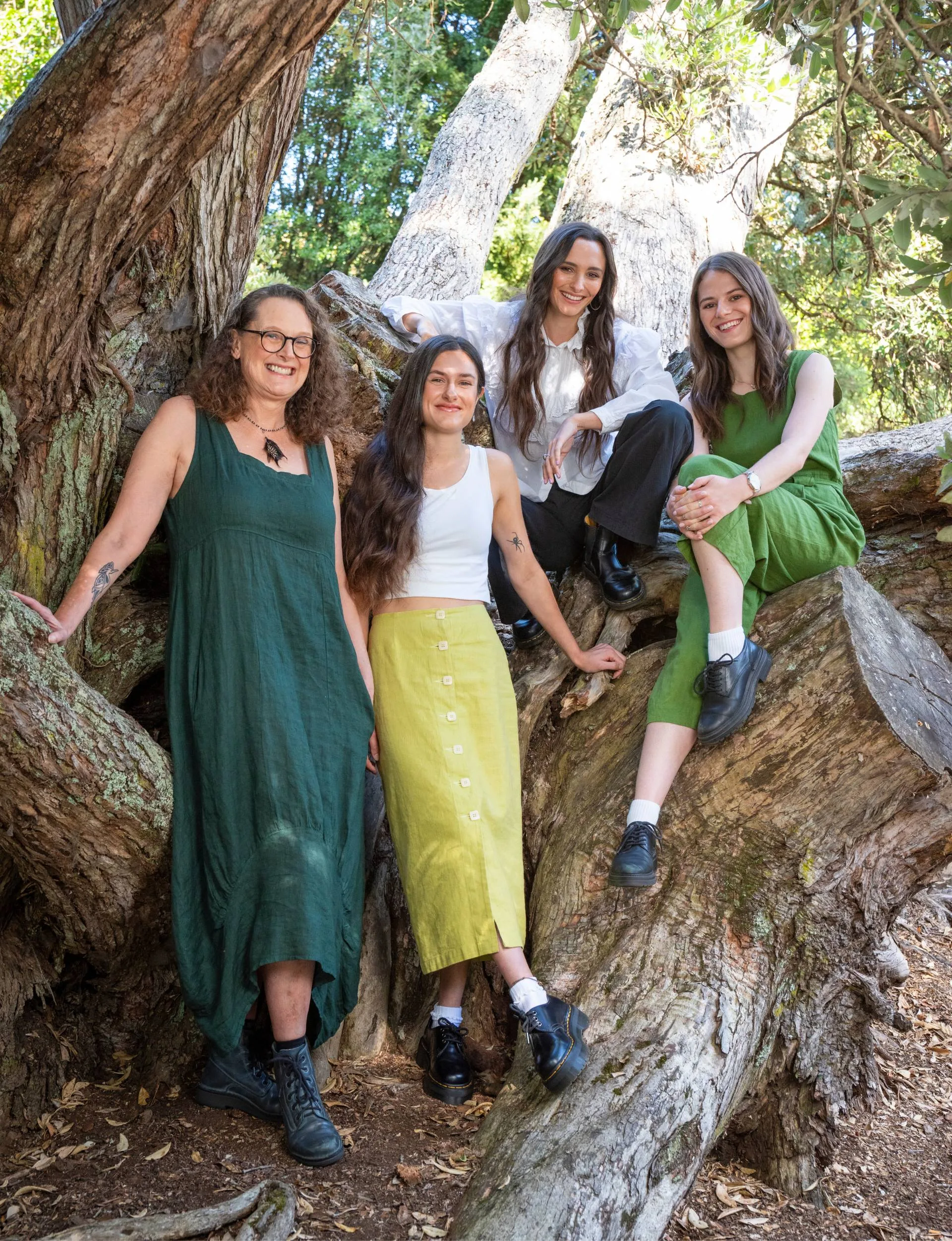Mirabai Pease sitting up a tree with her mum, sister and best friend