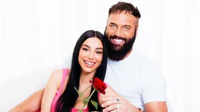 Naz Khanjani laying across her husband Jonny's lap