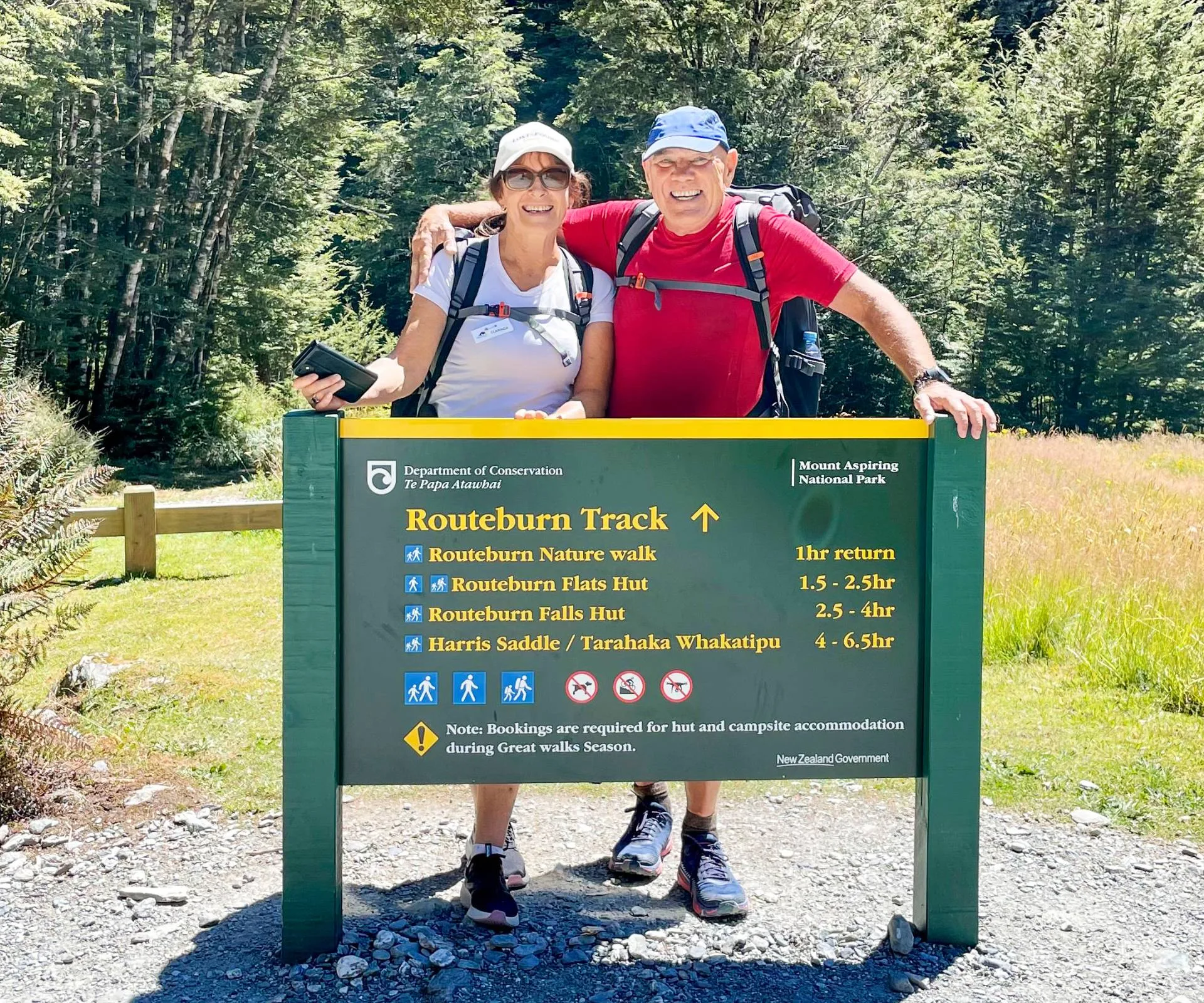 David Lomas and Clarinda Franklin with the Routeburn track sign