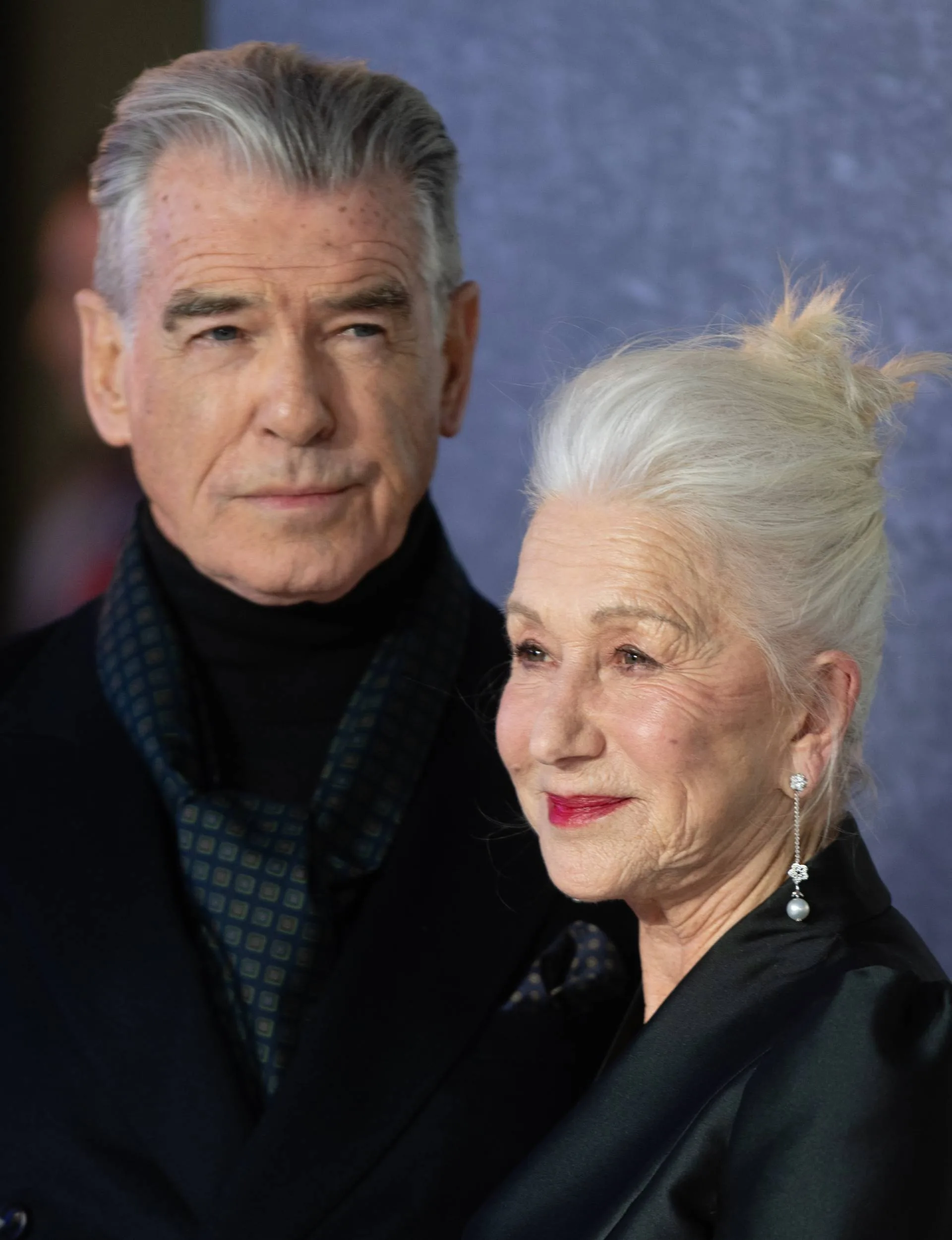 Helen Mirren on a carpet with Pierce Brosnan