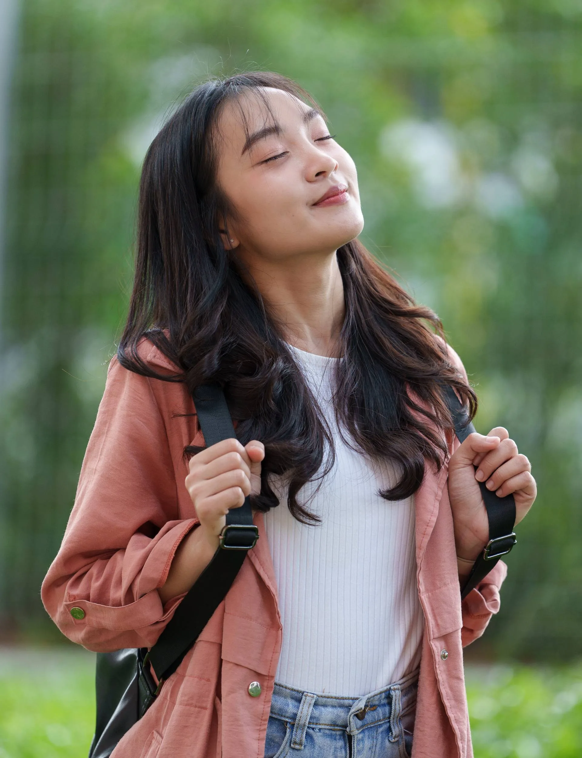 A woman breathing fresh air to make small life changes