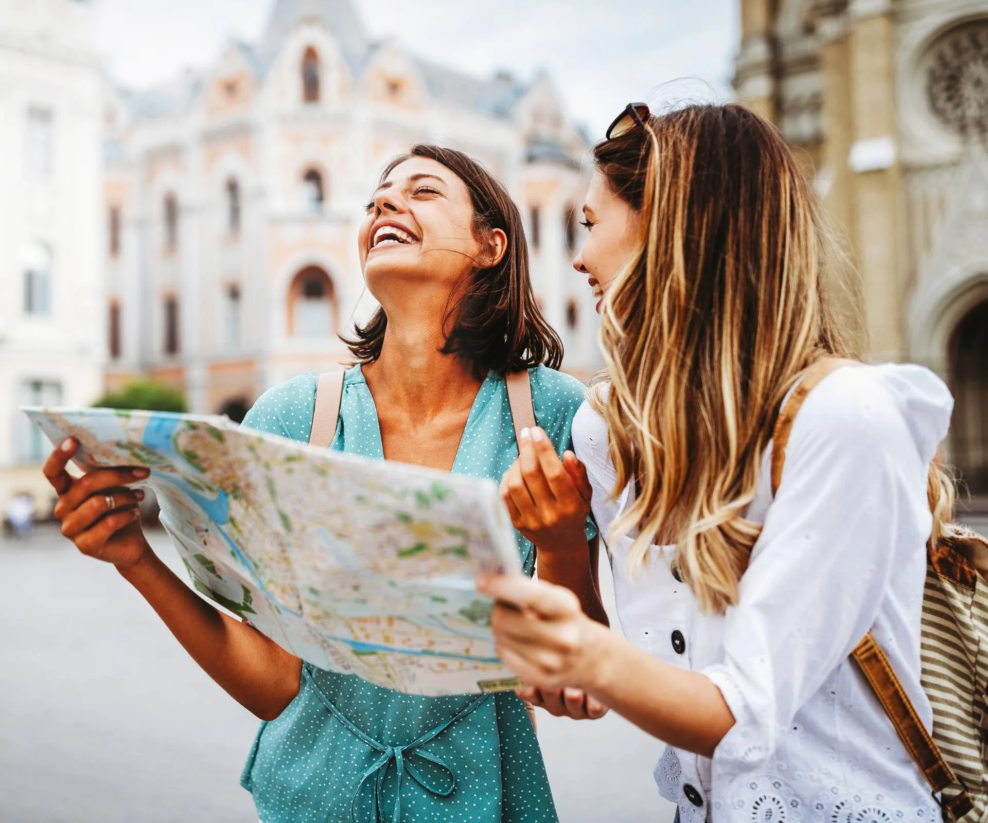 Two solo travellers sharing a map