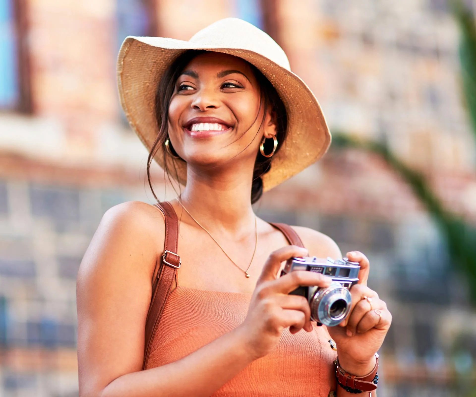 A woman with a camera travelling solo