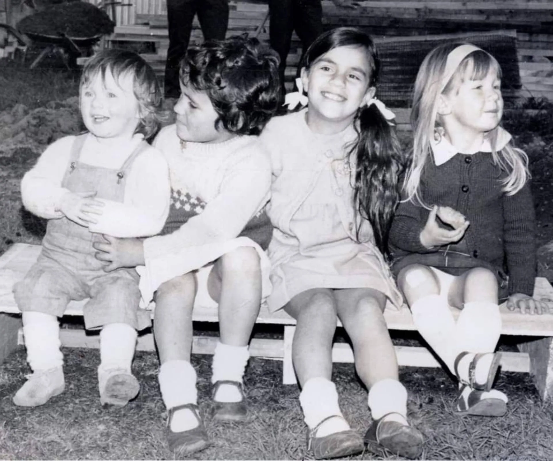 Lara with her cousins as a toddler