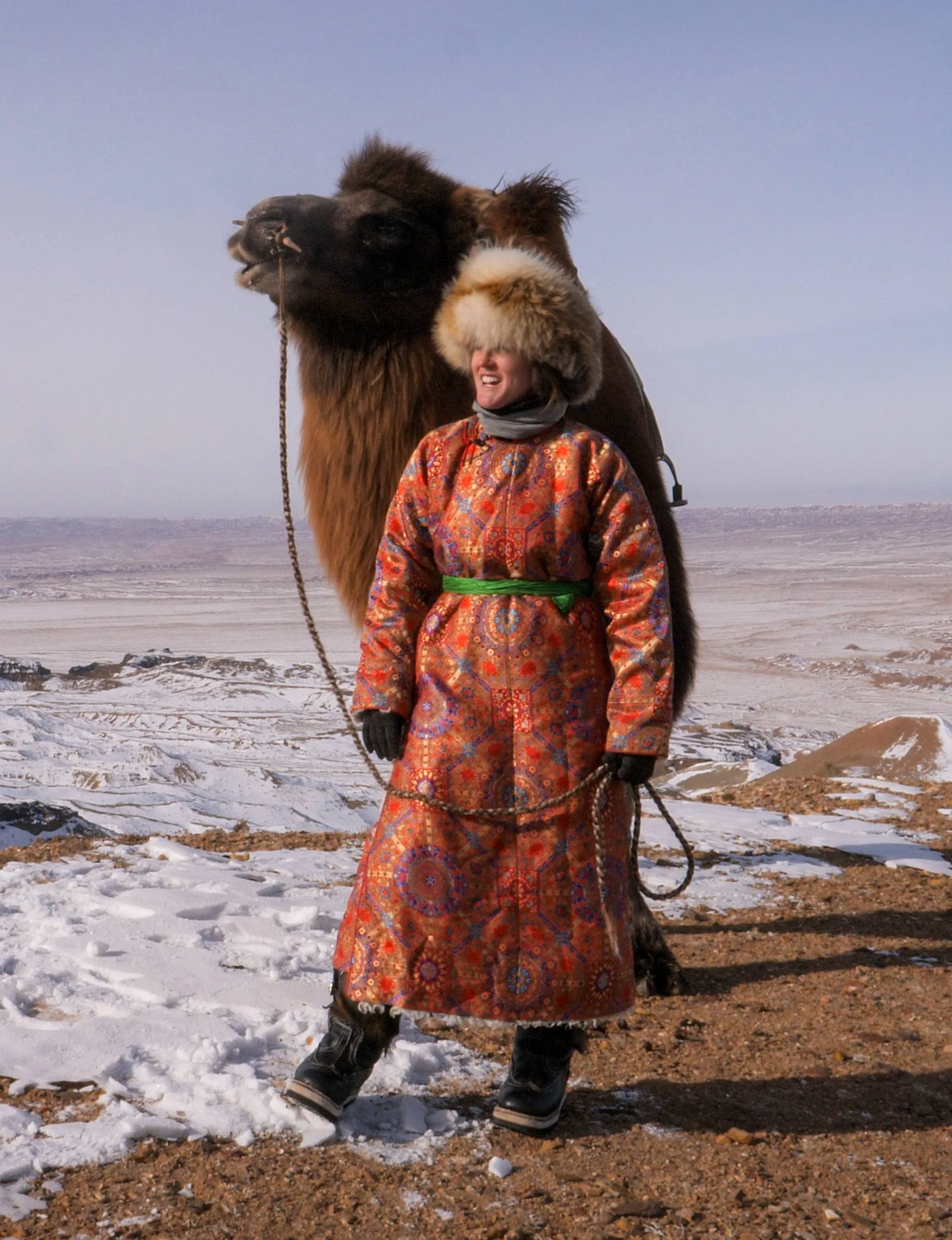 Chloe in Mongolia with a camel