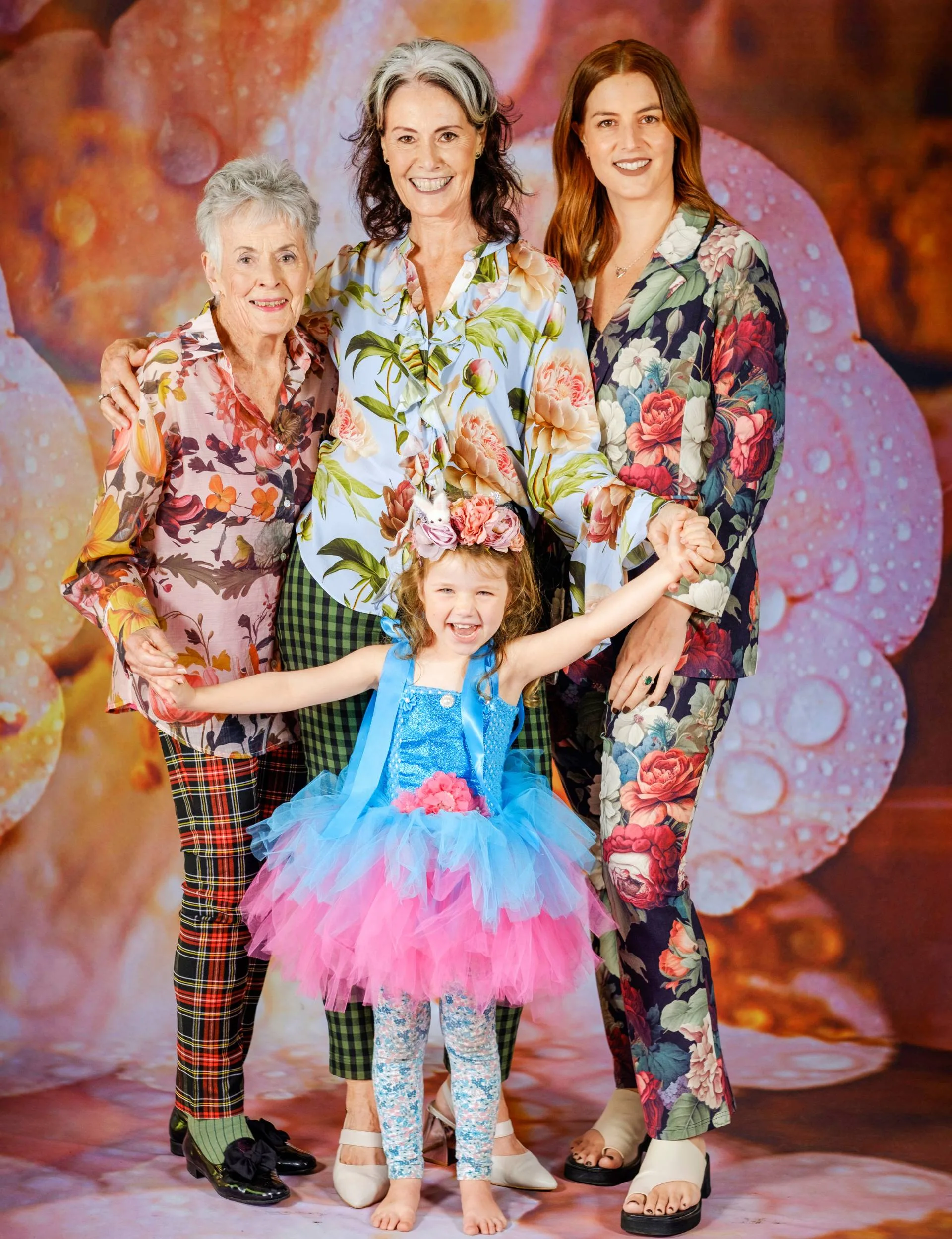 The Stretton Family in front if a floral backdrop