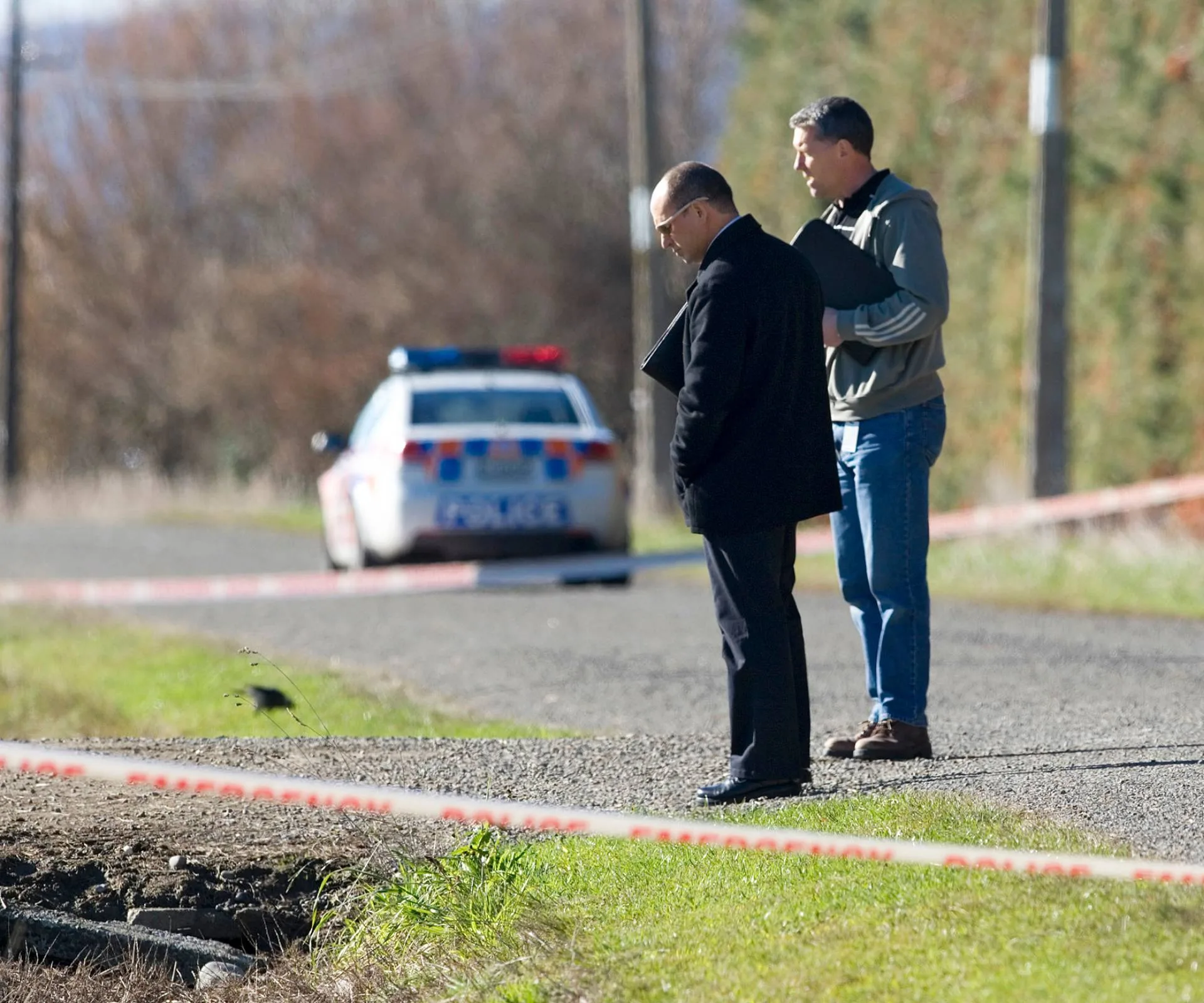 detectives at the crime scene