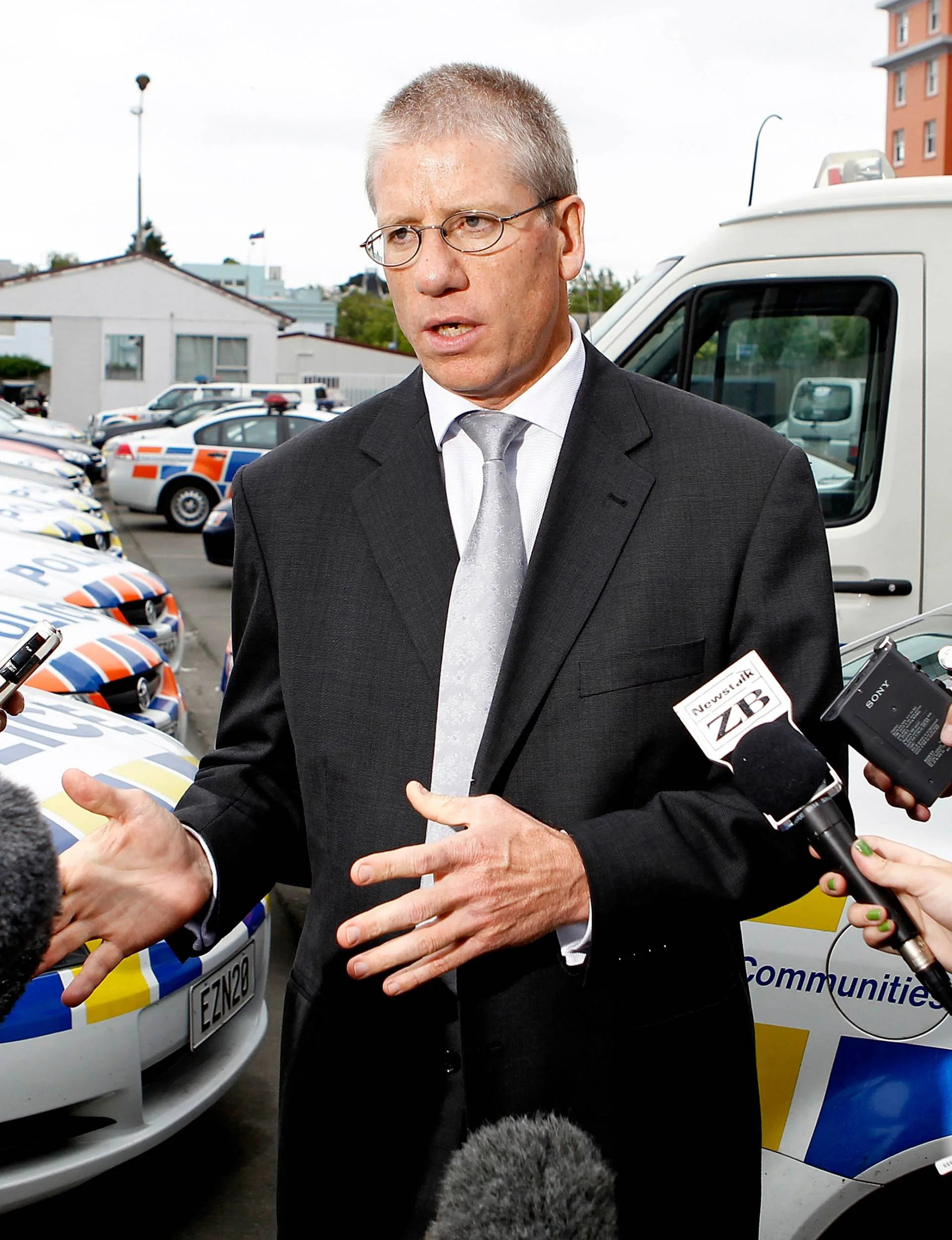 Detective Inspector Greg Williams speaking to the media outside of a police station.