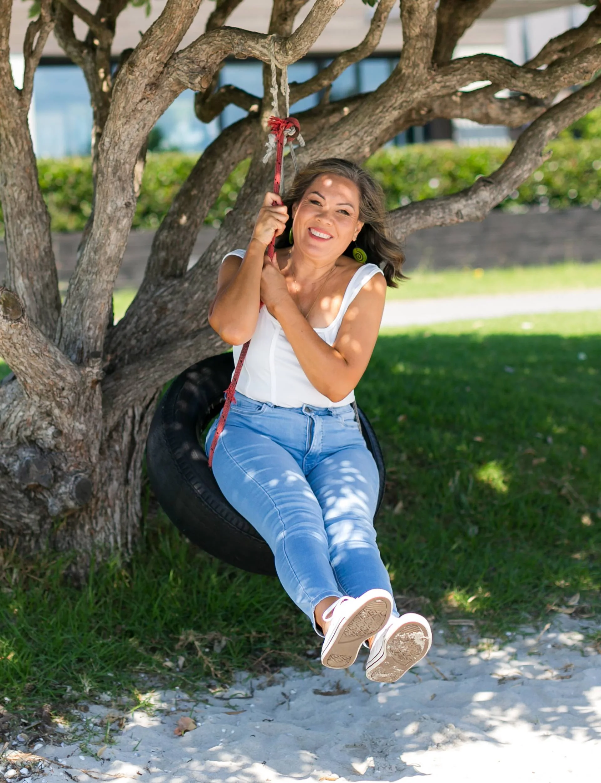 Delilah Whaitiri swinging on a tyre swing