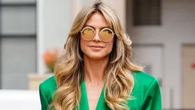 Heidi Klum with a flawless face of makeup after using her fast beauty fixes